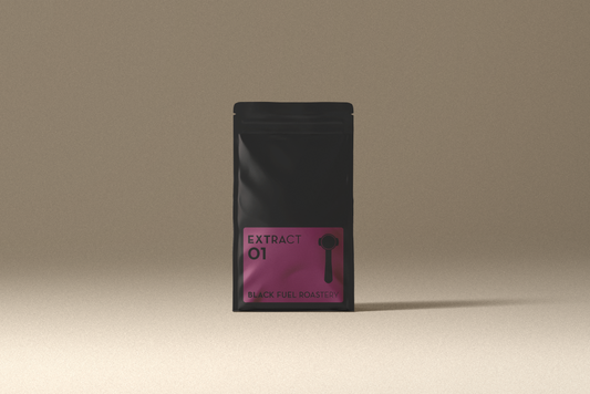 Black packaging with pink label on a beige background Black Fuel India